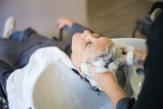 a person having their hair washed in a salon sink  | areen1